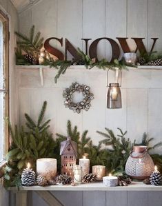 an image of christmas decorations and candles on a shelf with the words snow above it