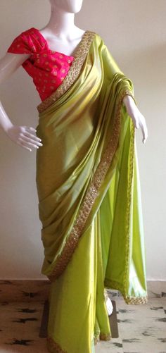 "Beautiful lime green semi silk saree with a buttery feel and soft sheen. The saree look totally out of the world paired with the gorgeous pink sequin blouse. You will absolutely glow in this wonderful saree. Its easy to wear too and pleats fall beautifully. Saree width :44\" Length :5.5 meters Blouse piece: 1 meter 44\" wide Shipping time is 4-5 days. Please don't hesistate to convo me if you have any questions" Green Fitted Saree For Festive Season, Fitted Green Saree For Festive Occasions, Light Pista Green Saree Contrast Blouse, Light Green Saree Blouse Combination, Green Saree With Resham Embroidery For Party, Green Resham Embroidery Saree For Party, Green Silk Blouse Piece For Party, Elegant Green Dola Silk Choli, Elegant Green Dola Silk Traditional Wear