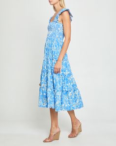 Price Comparison Few Moda $64 GANNI $255 Hill House $125 Product Details Adorable ruffled cap sleeves finish off the smocked bodice of this soft and breezy dress. Done with a tiered maxi skirt and side pockets. - Pockets- Square neckline- Maxi length- Content: 55% Linen, 45% Viscose Style# K21WDR10053 Fit Notes - Model wearing a size XS- Model measurements: 5'10.5'' Height / 32'' Bust / 25.5'' Waist / 34.5'' Hips- Garment measurements may vary due to the smocking bodice: Size Length Bust Waist X Flutter Sleeve Smocked Dress With Ruffles For Garden Party, Square Neck Smocked Sundress With Ruffles, Flutter Sleeve Smocked Sundress With Ruffles, Sundress Smocked Dress With Flutter Sleeves And Ruffles, Sundress With Flutter Sleeves And Ruffles, Sundress Style Smocked Dress With Flutter Sleeves And Ruffles, Summer Smocked Tiered Dress, Smocked Dress With Ruffled Straps For Garden Party, Summer Smock Tiered Dress