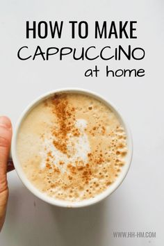 someone holding a cup of cappuccino with the words how to make cappuccino at home