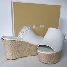 Nwb A Pair Of Chunky Textured Wedges With A Sleek Peep-Toe Design In The Smart Mix Of The Michael Michael Kors Cunningham Wedge Sandals That Match Many Apparel Looks. A Slim Rand & Logo Hardware Add Gleaming Touches To These Gorgeous White Leather Sandals That Features A Jute Wrapped Platform Wedge. Size 7.5 New With Box Retail Value $158 Purchased At Department Store Michael Michael Kors * Women's & Junior's Boho-Chic Dressy Casual Summer Sandals * Name- Cunningham Wedge Sandals * Color- White White Wedge Sandals With Branded Insole, Designer Synthetic Wedge Sandals, Designer Synthetic Platform Wedge Sandals, White Wedge Sandals With Woven Sole And Round Toe, Michael Kors Wedge Sandals With Platform, Michael Kors Platform Wedge Sandals, White Heels With Woven Sole, White Synthetic Wedge Sandals With Woven Sole, Michael Kors White Leather Sandals