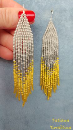 These handmade earrings are made of high-quality Czech beads and strong synthetic thread. They are elegant, fashionable, and highly versatile, suitable for everyday wear. Color: yellow, gray . There may be some color discrepancies which is due to the different monitor settings 100% hand made with love! Measurements: Long earrings Length-about 12cm (4.72 inch) Width -about 2 cm (0.79 inch) Medium earrings Length-about 8,5cm (3.3 inch) Width -about 2 cm (0.79 inch) Materials: Sterling silver compo Handmade Yellow Dangle Tassel Earrings, Chandelier Boho, Red Chandelier, Boho Earring, Earrings Chandelier, Abstract Floral Print, Earrings Bohemian, Earrings Long, Gray Yellow