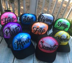 six hats with different colors and words on them