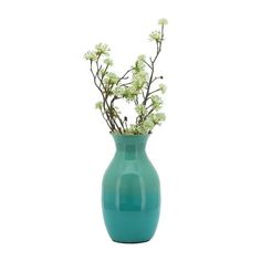 a green vase with white flowers in it