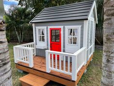 Wooden Playhouse Boy Cave With Black Metal Roof, a terrace with white railing and Red Half Glass Door in the backyard By WholeWoodPlayhouses Kids Outdoor Playhouses, Metal Terrace, Ladder Furniture, Outdoor Kids Playhouse, Stairs Furniture, Wooden Outdoor Playhouse, Boys Playhouse, Outdoor Playhouses, Playhouse Furniture