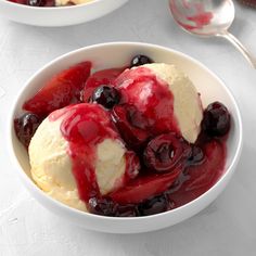 two bowls filled with ice cream and cherries