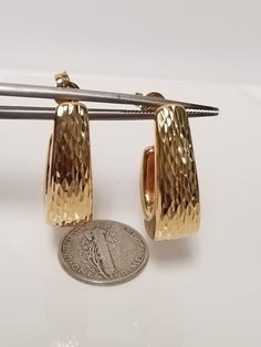 "Thanks for shopping our vintage estate store. We tend to sell well below wholesale and truly hope you enjoy all of our items. Many of the items are one of a kind, so please enjoy scrolling through the pictures and hopefully something will catch your eye. Brown spots are from the camera or reflections. Estate New 18k yellow gold diamond cut J Hoops art deco design earrings. Nice and heavy. Length: 1\" Width: 3/8\" Weight: 4.28 grams Sweet earrings, marked 18k, backs are 14k." Anniversary 14k Gold Polished Earrings, Luxury Yellow Gold Earrings, Vintage 14k Gold Earrings With Polished Finish, Vintage Yellow Gold Earrings For Anniversary, Formal Hammered 14k Gold Hoop Earrings, Elegant Hammered Hoop Earrings For Anniversary, Hammered Hoop Earrings For Anniversary, Gold Hammered Hoop Earrings For Formal Occasions, Formal Gold Hammered Hoop Earrings