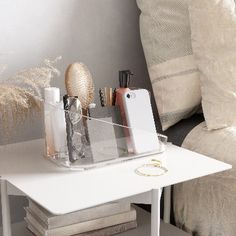 a white table with some items on it and a chair in the backround