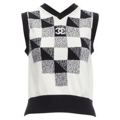 CHANEL 100% cashmere black white graphic check CC logo sweater vest FR36 S Reference: AAWC/A00458 Brand: Chanel Designer: Virginie Viard Material: Cashmere Color: Black, White Pattern: Checkered Closure: Pullover Extra Details: CC Chanel button at back. Made in: Italy CONDITION: Condition: Excellent, this item was pre-owned and is in excellent condition. This piece appears to be unworn and is in great condition. Comes with: Style code present (Generic) SIZING Designer size: FR36 Size reference: US2-4 / UK8 / IT40 / FR36 / XS-S MEASUREMENTS: Shoulder to shoulder: 35cm / 13.7" Chest: 41cm / 16" Waist: 43cm / 16.8" Hip: 36cm / 14" Length: 53cm / 20.7" This Chanel item is authentic. Cocoon Jackets, Shawl Collar Blazer, Chanel Women, Vintage Chanel Bag, Chanel Suit, Chanel Designer, Cashmere Color, Black White Pattern, Cc Logo