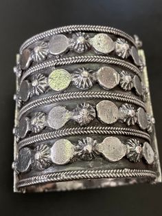 "Spectacular silver tribal hinged cuff bracelet geometric borders. Origin and age are unknown, but this is suspected to be quite old, possibly 19th century. India is a possibility. The pin closure is tight and very secure. The hinge opens and closes well. Nice geometric embellishments at the hinge and the closure. Hard to find size for a small wrist at 6 3/8\". Extremely heavy at 166 grams. Please see other silver jewelry here: https://www.etsy.com/shop/CrescentCityConnect?section_id=16957559&am Unique Oxidized Metal Cuff Bracelet, Unique Metal Cuff Bracelet With Oxidized Finish, Unique Antique Silver Bracelets With Oxidized Finish, Unique Antique Silver Bracelet With Oxidized Finish, Unique Oxidized Cuff Bracelet Bangle, Unique Oxidized Finish Cuff Bangle, Ornate Oxidized Cuff Bracelet Bangle, Ornate Oxidized Bangle Cuff Bracelet, Silver Metal Bracelets With Antique Finish