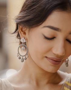 Aadya, named after the goddess Durga, draws inspiration from the ornate antique doors adorning India's palaces and monuments. Crafted with exquisite gunmetal-colored silver-finished brass, these danglers exude antique charm. Featuring 925 silver earring posts for comfort and quality. Bohemian Silver Bridal Earrings With Latkans, Bohemian Bridal Earrings With Latkans In Silver, Bohemian Bridal Silver Earrings With Latkans, Silver Temple Jewelry Chandelier Earrings With Intricate Design, Silver Temple Jewelry Chandelier Earrings With Latkans, Ornate Oxidized Earrings For Festive Occasions, Silver Pierced Chandelier Earrings For Festive Occasion, Silver Bridal Earrings With Intricate Temple Jewelry Design, Ornate Silver Bridal Earrings With Latkans