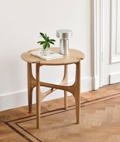 a small table with a plant on it