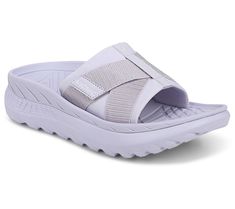 Ahhh, sweet relief. That's what you'll get when you slip your tired tootsies into these unisex recovery sandals. The sporty slides feature a soft neoprene upper with an adjustable hook-and-loop cross strap and a cushioned lining for maximum comfort and support.  Offering a fashion-forward take on recovery footwear, these shoes pair well with your casual and athleisure looks. Wear them after a low-impact workout, while you're walking the dog, or when you're padding around the house on a lazy Sund Comfortable Slip-on Sport Sandals, Sporty Slide Sandals For Outdoor Activities, Comfortable Non-slip Synthetic Sport Sandals, Non-slip Comfortable Synthetic Sport Sandals, Comfortable Slide Sport Sandals For Outdoor Activities, Comfortable Breathable Slide Sport Sandals, Breathable Slide Sport Sandals For Outdoor Activities, Gel Cushioned Slide Sport Sandals, Sport Slide Sandals With Gel Cushioning