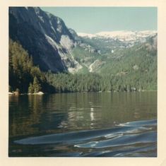 a lake with mountains in the background