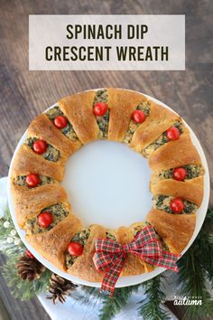 a white plate topped with a bundt cake covered in spinach and tomato slices