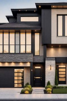 Modern two-story house with large windows, stone and stucco facade, and well-manicured landscaping. Brown Siding With Black Trim, Black Modern Windows Exterior, Minimalist Black House, White Brick House Exterior Black Windows, Black And White Interior Design Modern, Modern Black And White House, Dark Modern House Exterior, Black Exterior House