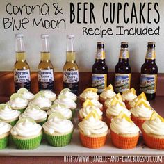 cupcakes and beer are arranged on a tray