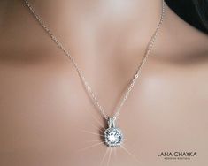 Wedding Clear Cubic Zirconia Halo Dainty Bridal Charm Necklace with .925 Sterling Silver Chain. CHAIN is 18 inches (45.7 cm) long, PENDANT is about 10x15mm (0.39x0.59 inch). Classy and elegant, this dainty necklace would be perfect for any wedding or occasion! This necklace has .925 Sterling Silver 18 inches chain, and Rhodium Plated halo component with Clear Cubic Zirconia stones. NECKLACE will be shipped in a Free gift box. INTERNATIONAL CUSTOMERS, PLEASE NOTE: Byers are responsible for any cu Sparkling Cubic Zirconia Necklaces For Weddings, Crystal Rhinestone Necklace For Wedding, Crystal Jewelry With Halo Setting For Wedding, Wedding Crystal Jewelry With Halo Setting, Diamond Necklaces With Halo Setting For Weddings, Dazzling Cubic Zirconia Rhinestone Necklace For Wedding, Dazzling Sparkling Necklace For Wedding, Dazzling Sparkling Wedding Necklaces, Sparkling Wedding Necklace