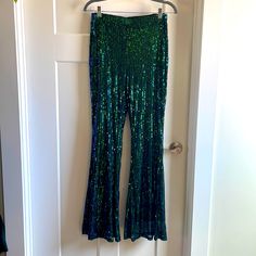 New Never Worn Sequin Flare Pants From Shein. Green/Purple In Color. Stretchy Green Sequin Pants, Green Sequined Party Bottoms, Stretch Sequined Flare Pants, Traditional Mardi Gras Pants, Pants From Shein, Purple Sequin Flare Pants, Sequin Flare Pants, Shein Pants, Mardi Gras Party