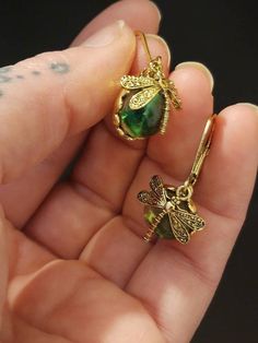 Check out this item in my Etsy shop https://www.etsy.com/listing/1059874489/dragonfly-sun-catcher-earrings Nickel-free Gold Dragonfly Jewelry, Green Spiritual Earrings For Gift, Spiritual Green Earrings For Gift, Green Hypoallergenic Jewelry Gift, Hypoallergenic Green Jewelry Gift, Spiritual Dragonfly Jewelry Gift, Metal Earrings For May Birthstone Gift, Dragonfly-shaped Pierced Earrings As Gift, Handmade Green Dragonfly Jewelry