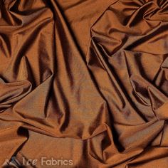 a close up view of a brown fabric with very thin lines and folds on it