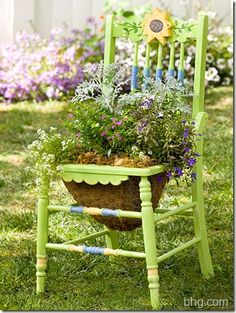 an old - looking chair is decorated with flowers