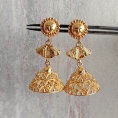 This is a beautiful 22k Real Gold pair of jhumka Earrings .  This is the perfect gift for mom, wife, fiancée, girlfriend, valentine, daughter, family or friend. It is a special gift for mother's day, valentine's day, wedding, anniversary, birthday, Christmas, Easter, New Year's and any holiday. 1. Material Details ✫ Gold : 22K (Real Gold) ✫ Gold Color Options: Yellow Gold ✰ Shape: floral ✰ Color: Yellow ✰ Weight:  10.196 grams approx. Terms & Conditions If there is any change. We request buyer t 22k Gold Dangle Jhumkas For Festive Occasions, 22k Gold Chandbali Jhumkas For Festive Occasions, Festive 22k Gold Jhumkas With Latkans, Gold Jhumkas For Puja And Festive Occasions, Festive Gold Jhumkas For Puja, 22k Gold Chandbali Danglers With Latkans, Gold Plated Jhumkas With Latkans For Festivals, Gold Bollywood Jhumkas With Tilla Details, Gold Bollywood Jhumkas For Ceremonial Occasions