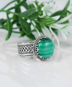 "This Malachite Sterling Silver Women Cocktail Ring is a finely handcrafted and unique piece of jewelry. It is a unique and stylish gift option for yourself or your loved one. A natural stone, cabochon cut malachite sits within 925 solid sterling silver filigree art ring which makes it an artisan made, handcrafted boho cocktail ring. Handcrafted by skilled artisans, this ring features a 12 mm round cabochon cut Malachite gemstone cut from genuine Malachite. This elegant cocktail ring is hand finished with polished edges and inscribed with \"Malachite\". The organic and earthy tones of the stone are echoed in the pattern on the band, reminiscent of swirling waves or rippled water. This stylish boho cocktail ring makes a festive gift for yourself or a loved one, and can be worn with casual a Metal Embroidery, Art Cocktail, Art Ring, Filigree Earrings, Sterling Silver Filigree, Mesopotamia, Filigree Ring, Delicate Rings, Silver Filigree