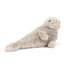 a stuffed seal animal laying on its side