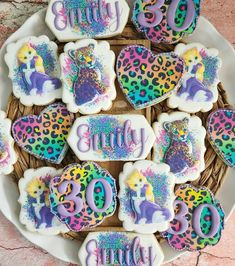 some decorated cookies are on a plate