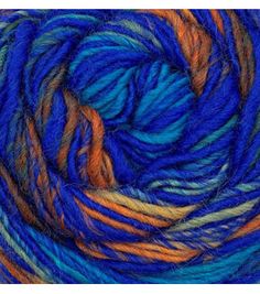 blue, orange and yellow yarn is in the shape of a ball