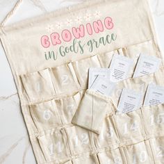 a group of seed packets sitting on top of a table next to a bag with numbers