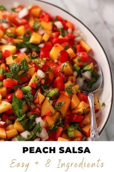 a white bowl filled with chopped vegetables and garnished with cilantro on top