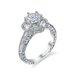 a white gold engagement ring with baguetts and diamonds