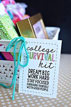 a college survival kit sitting on top of a table next to a basket filled with books