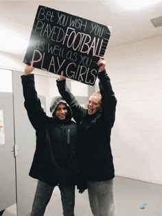 two people holding up a sign that says, be yourself when you have too talented for we've got to play girls