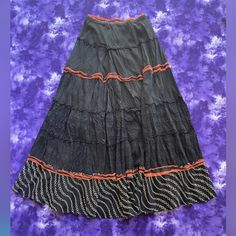 Vintage Johnny Was Black Ruffle Skirt With Red Ribbon Trimming And Black And White Embroidery. Floor Length Maxi Skirt In Great Condition. Black And White Embroidery, Floor Length Maxi Skirt, Black Ruffle Skirt, Ruffle Maxi Skirt, White Embroidery, Black Ruffle, Ruffle Skirt, Johnny Was, Red Ribbon