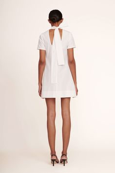 The Mini Ilana is a high neck mini dress with a scoop back and functional, self-tie bow collar. Constructed out of grosgrain fabric, this dress is the perfect statement piece for any occasion. Mini Dress With Bow For Work, Chic Mini Dress With Bow For Work, Chic Mini Dress With Bow For Daywear, Chic Bow Mini Dress For Work, Chic Bow Mini Dress For Daywear, Fitted Mini Dress With Bow For Daywear, Mini Length Workwear Dress With Bow, Summer Tie Neck Dress With Bow, Feminine Daywear Dress With Bow Tie Back