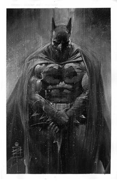 batman in the rain with his arms crossed