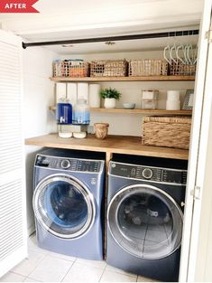 a washer and dryer in a room with open shelves on the wall next to each other