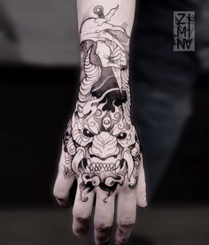 a person with a tattoo on their hand