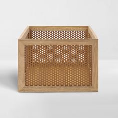 a wooden box with holes in it