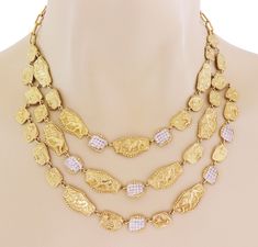 This is a stunning authentic necklace by Seidengang Athena collection, crafted from 18k yellow gold featuring a bib style with a triple strand of assorted shape and size gold plaque motifs with fine bead edge, the smaller shapes are decorated with diamonds and some with embossed stars, the longer motifs has an embossed full figure lion, some with only the lion's head. A small round link is attached to the end of each plaque to connect to the other. This gorgeous style show off the layered strand Cartier Love Bangle, Stars Necklace, Lion Star, Gorgeous Style, David Webb, Emerald Diamond Ring, Bib Necklaces, Gold Band Ring, Multi Strand Necklace