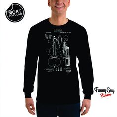 Cello Patent Long Sleeve Shirt that will certainly make a perfect gift for your friend or loved one. Awesome design for passionate people. Quality shirts and fast processing of all orders 24/7, I answer all question quickly and my main focus is on customer satisfaction.If there's anything you want to ask go ahead and send me a message.  If you need any other type of shirt (ladies, v neck, polo, long sleeve or hoodie) just write to me and I'll make it for you, no problemo. If you need a shirt qui Music-themed Long Sleeve Cotton Top, Music-themed Cotton Long Sleeve Top, Gift Black Long Sleeve Shirt, Black Long Sleeve Shirt Gift, Graphic Print Long Sleeve Shirt As Gift, Cello Player, Gift For Musician, Polo Long Sleeve, Passionate People