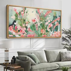 a living room filled with furniture and a painting on the wall