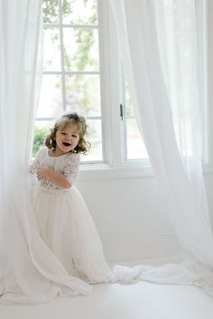 "This two piece set is just beautiful! It includes a delicate white lace bodice with buttons up the back. Also, a flow princess tulle skirt in ivory with an elastic waist band. This dress set is the perfect amount of bohemian, beachy, classy, romantic style that will keep your little one comfy and looking amazing! Perfect for your next special event. Size Top LengthBustSleeveSkirt Length 6 months8.75\"17.5\"8.25\"19.75\" 12 months9\" 18\" 8.25\"21\" 2T 9.5\" 19.75\"8.75\"23\" 3T 10.25\"21.25\"8. White Fitted Princess Style Set, Lace Wedding Dress With Flowy Skirt, Lace Dress With Flowy Tulle Skirt, White Flowy Bridesmaid Dress, Flowy Lace Dress With Tulle Skirt, Summer Princess Style White Gown, Cream Flowy Wedding Dress, Flower Girl Dress Boho, Wedding Crochet