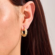 Add a bold twist to your style with our Bold Twist Hoop Earrings.These stunning earrings feature an eye-catching twisted design that sets them apart from classic hoops. These hoops are both durable and lightweight, ensuring comfort for all-day wear. Perfect for making a statement at special events or adding a touch of flair to your everyday look. - Made in 14k solid gold - Earring Width: 4.86 mm / 0.19 inches - Thickness: 4.74 mm / 0.18 inches - Length: 20.25 mm / 0.80 inches - This product comes with iconic Norm Jewels gift box Modern Twist Hoop Earrings For Everyday Wear, Hypoallergenic Hoop Earrings With A Modern Twist, Modern Twist Tarnish Resistant Huggie Earrings, Modern Twist Hypoallergenic Hoop Earrings, Modern Twisted Metal Hoop Earrings, Twisted Yellow Gold Earrings, Twisted Gold Hoops Earrings, Twisted 14k Gold Hoop Earrings, Gold Twisted Metal Hoop Earrings