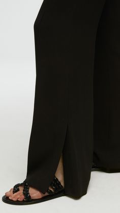 Made of a lightweight wool crepe, this slim, straight trouser sits at the natural waist and features pintuck details. Functional details include an invisible zipper at the side seam for dressing ease and a vent opening at the hem. Chic Straight Silhouette Evening Bottoms, Elegant Formal Wide Leg Pants With Straight Silhouette, Elegant Formal Bottoms With Seam Detailing, Sleek Straight Silhouette Bottoms For Evening, Formal Wide Leg Pants With Straight Silhouette, Formal Wide Leg Straight Silhouette Pants, Chic Formal Pants With Seam Detailing, Elegant Formal Pants With Seam Detailing, Elegant Straight Silhouette Bottoms For Evening