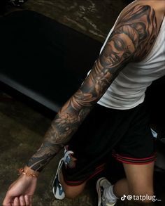 a man with a tattoo on his arm