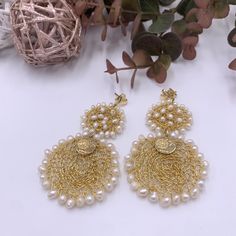 Elegant and unique real pearl earrings. These splendid and lightweight handmade crochet earrings represent a different way to wear pearl jewelry. These fresh water pearl earrings blend the classic appeal of real pearl with trendy style! ♥ ITEM DESCRIPTION: Earring Dimensions: Total Length: 2.2 inches. Width: 1.6 inches. Materials: gold plated wire - gold filled earrings base - Freshwater pearls. Color available: Gold Pearls color: white. ♥ GIFT IT Jewelry comes in a cute organza bag ready to gif Handmade Pearl Chandelier Earrings, Handmade Pearl Chandelier Earrings Gift, Handmade Chandelier Earrings For Wedding, Elegant Crochet Dangle Earrings, Elegant White Handwoven Earrings, Elegant Handwoven Dangle Earrings, Bohemian Gold Pearl Drop Bridal Earrings, Bohemian Gold Bridal Earrings With Pearl Drop, Handmade Delicate Bridal Earrings For Parties